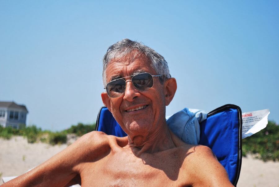 Luke's grandpa sitting on the beach