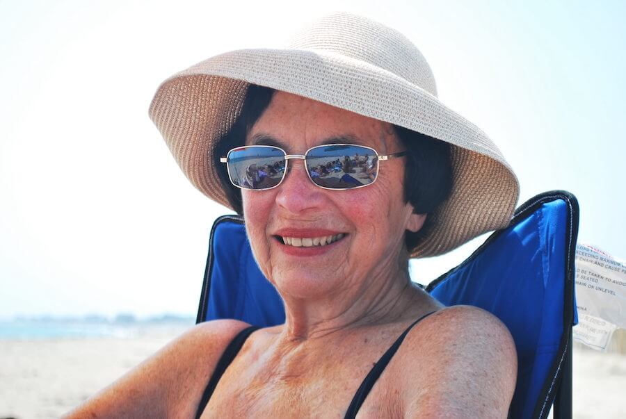 Luke's grandma sitting on the beach