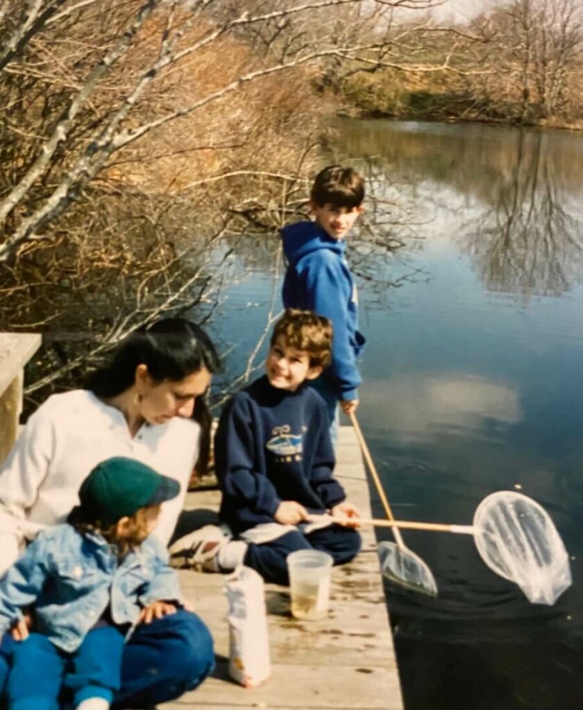 Luke as a child with a fishing net